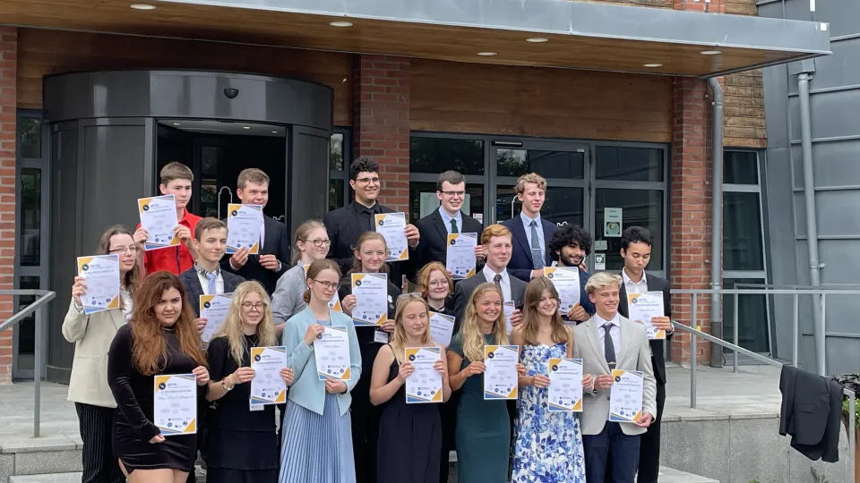 Participants of RFS 2023 holding their diplomas.  Photo.