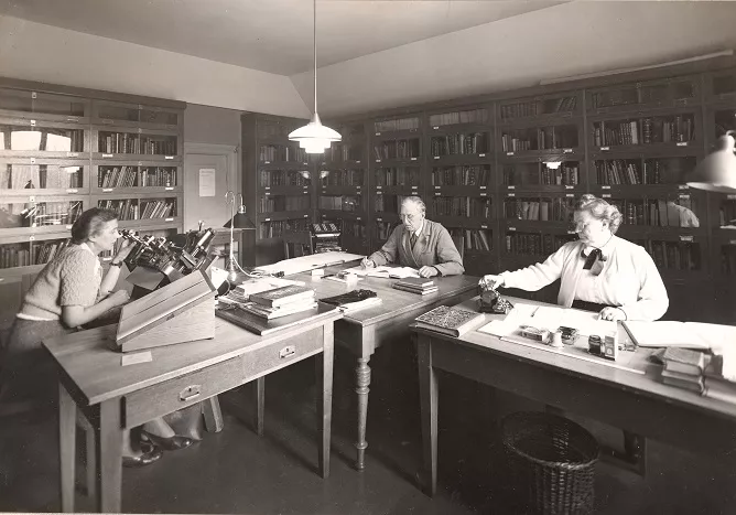Astronomers working at their desks
